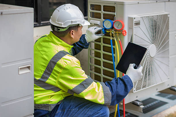 Professional Heat Pump Repair technician working in Paxton, FL